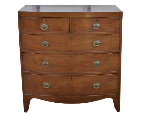A Regency mahogany bowfront chest of drawers, with two short and three long drawers, with shaped apron and bracket feet, H 10