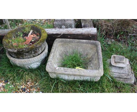 A reconstituted stone square planter, with rustic floral boarder, on square plinth, 48cm high x 52cm square, together with an