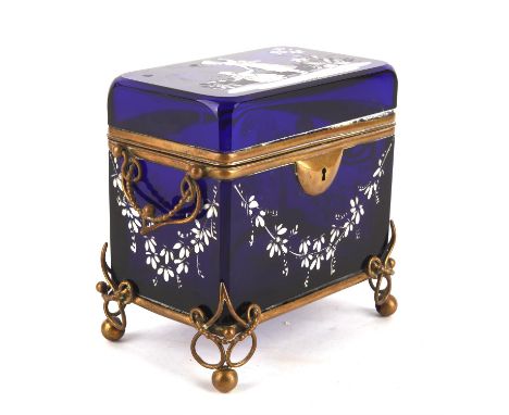An English blue glass casket, 19th Century, with brass mounts and scroll bracket feet, resting on balls, decorated in the sty