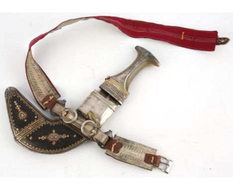 Omani khanjar with horn handle, the leather scabbard with gold and silver coloured metal thread decoration, and mounts. You m