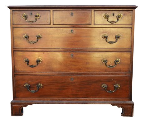 A George III mahogany chest of drawers, the moulded top above three short and three long drawers, on carved bracket feet, bac