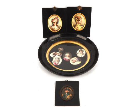 Two Continental oval portrait plaques of ladies, late 19th/early 20th century, in black japanned frames with loop and acorn c