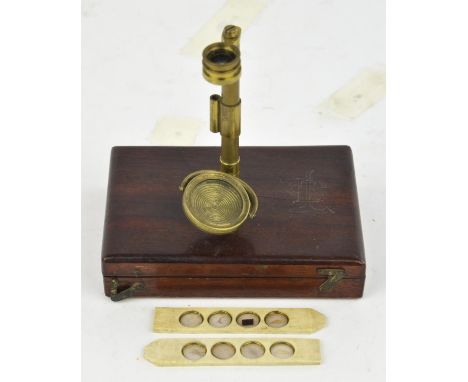 A 19th Century, gilt brass Botanical Microscope, containing two objectives, adjustable specimen slide, three wooden slides, a