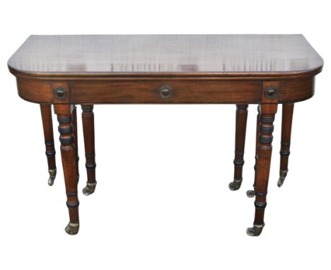 A Regency mahogany extending dining table, 1800s, with scissor action, folding down to a D-shaped side table and extending to