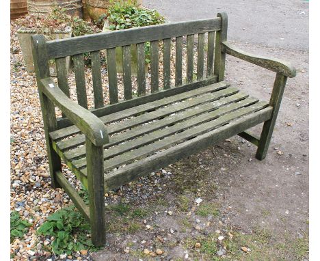 A wooden garden bench, of typical form, 122cm wide