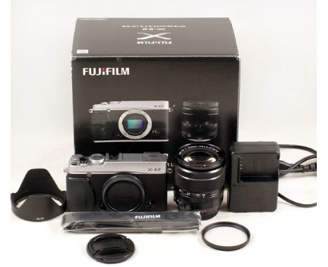 Chrome Fuji X-E2 Mirrorless Camera Outfit. Comprising X-E2 body #34N03108 with XF 18-55mm f2.8-4 R LM OIS zoom lens. With bat