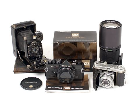 A Good, BLACK Olympus OM-2n MD in Makers Box. New batteries fitted, (tiny ding to corner, hence condition 5F). With a good Ol
