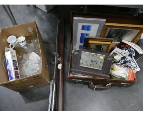 Vintage suitcase containing picture frames, Art Deco mantel clock, Manchester United football programmes, postcards, projecto