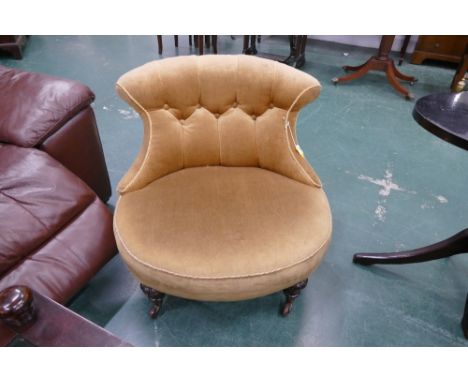 Deep button Victorian low chair in gold coloured velvet type material 