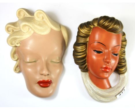 A 1950's Goldscheider terracotta wall mask, H. 23cm, together with a similar period ceramic mask.