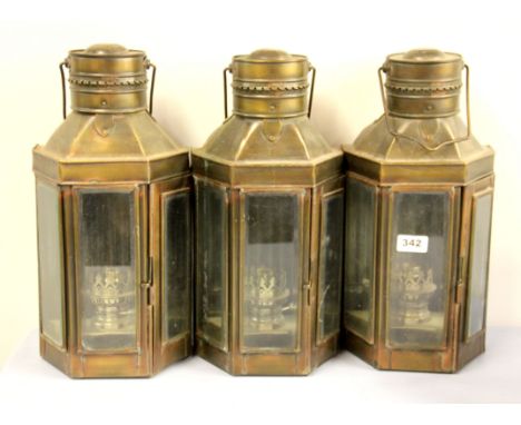 Three oil lamp style electric wall lamps, H. 41cm.