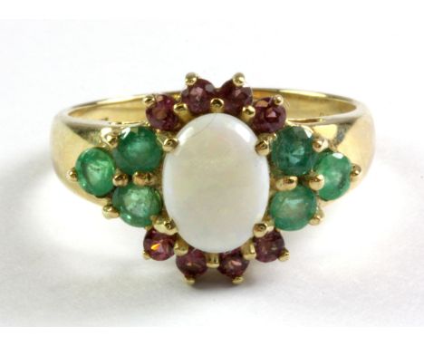 A 9ct yellow gold ring set with opal, emerald and garnets with certificate, (N.5).