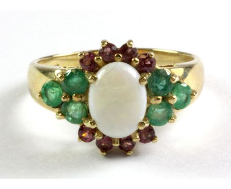 A 9ct yellow gold ring set with opal, emerald and garnets with certificate, (N.5).