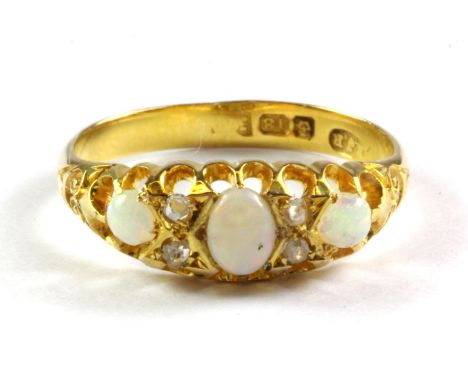 An 18ct yellow gold opal and diamond set ring, (P).