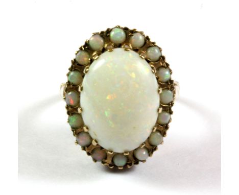 A 9ct yellow gold large opal set cluster ring, (N).