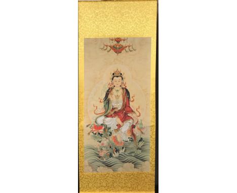 A large Chinese silk mounted scroll of a seated Tibetan Tara, 67 x 171cm.