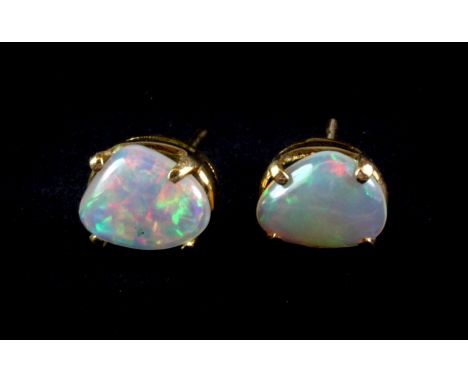 A pair of 18ct yellow gold mounted opal set stud earrings.