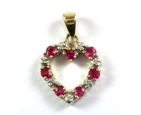 A 9ct yellow gold ruby and diamond set heart shaped pendant, L. 2cm.