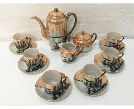 JAPANESE EGGSHELL COFFEE SETwith lustre finish and hand painted Mount Fuji decoration, comprising a coffee pot, a milk jug, a