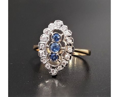 SAPPHIRE AND DIAMOND PLAQUE RINGthe central three vertically set sapphires in multi diamond set pieced and shaped surround, o