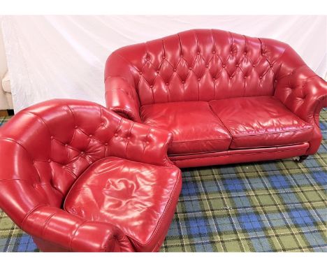 HUMP BACK SOFAin red leather with button back and arms, standing on turned front supports with brass castors, 164cm wide, tog