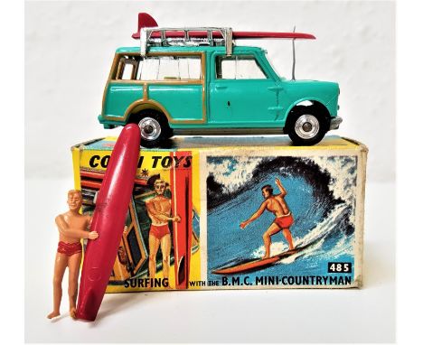 VINTAGE CORGI 485 BMC MINI COUNTRYMAN SURFINGin teal with a yellow interior, two roof mounted surf boards and a figure, with 