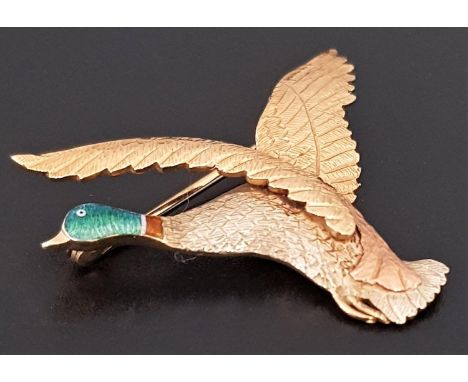 ENAMEL DECORATED NINE CARA GOLD DUCK BROOCHthe yellow, rose and white gold duck with textured finish to simulate feathers and