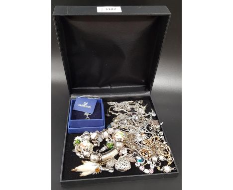 SELECTION OF FASHION AND COSTUME JEWELLERYincluding a Swarovski star pendant on chain, with box; Pandora style charm bracelet