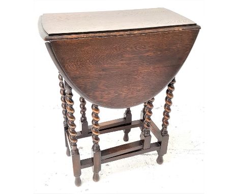 OAK GATE LEG OCCASIONAL TABLEwith shaped drop flaps, standing on barley twist supports, 59.5cm wide 
