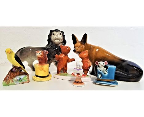 SELECTION OF POTTERY ANIMALSincluding a seated fox, lion, bird perched on a branch, two bears playing with a ball, squirrel s