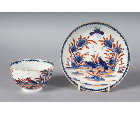 AN 18TH CENTURY. WORCESTER RARE TEA BOWL AND SAUCER painted in under-glaze blue and over-glaze red with the Two Quails patter