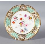 A NANTGARW PORCELAIN PLATE 8.25ins diameter, with gilt border, the centre painted with flowers.