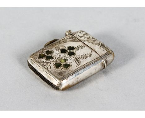 AN ENGRAVED SILVER PLATE VESTA with enamel shamrocks.