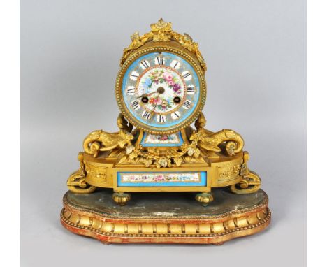 A GOOD 19TH CENTURY FRENCH ORMOLU AND SEVRES PORCELAIN MANTLE CLOCK, the case with griffin and garlands, 9ins high, on a gilt