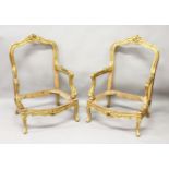 A PAIR OF FRENCH CARVED AND GILDED FAUTEUIL FRAMES.
