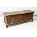 A 17TH CENTURY WALNUT LONG COFFER, with plain top, two panels to the front, supported on bold claw