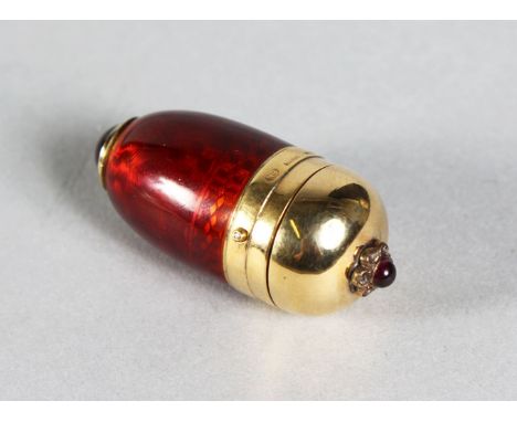 A GOOD RUSSIAN GOLD AND RED ENAMEL EGG SHAPED SCENT BOTTLE set with cabochon stones and diamonds. 1.5ins long.