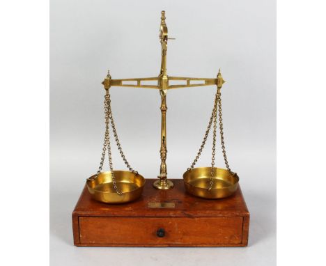 A 19TH CENTURY MAHOGANY AND BRASS SET OF BALANCE SCALES, weights in the drawer.