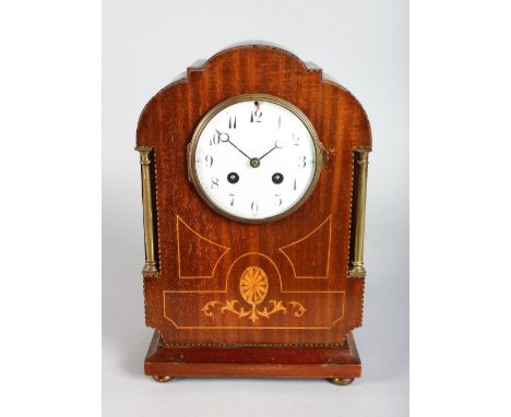 AN EDWARDIAN MAHOGANY INLAID MANTLE CLOCK, chiming, with white enamel dial. 12ins high.