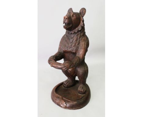 A CARVED "BLACK FOREST" BEAR STICK STAND. 3ft 0ins high.