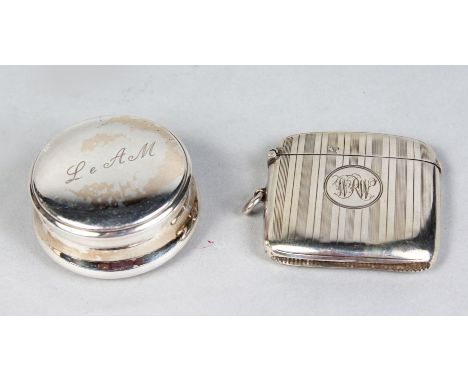 A CIRCULAR SILVER PILL BOX and AN ENGINE TURNED VESTA. Birmingham 1914 (2).
