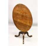 A 19TH CENTURY OAK CIRCULAR TILT TOP TRIPOD TABLE. 2ft 9ins diameter.
