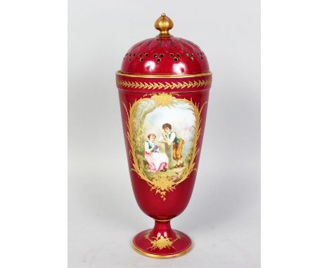 A SEVRES RED PORCELAIN VASE AND COVER, painted with reverse scenes of young children and a landscape scene with a mill. 13ins