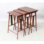 A NEST OF THREE MAHOGANY TABLES, 20TH CENTURY, with rectangular tops, on slender tapering square