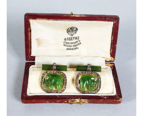 A GOOD PAIR OF FABERGE GOLD, DIAMOND AND JADE CUFFLINKS carved with elephants, in a lesther Faberge box.