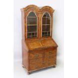 A GOOD 18TH CENTURY WALNUT DOUBLE DOME TOP BUREAU BOOKCASE, with a moulded cornice, pair of arched