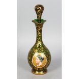 A GOOD BOHEMIAN OVERLAY RUBY GLASS BOTTLE AND STOPPER, with an oval portrait of a man. 10ins high.