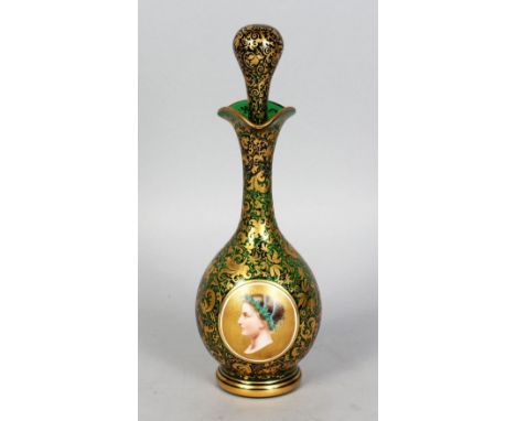 A GOOD BOHEMIAN OVERLAY RUBY GLASS BOTTLE AND STOPPER, with an oval portrait of a man. 10ins high.