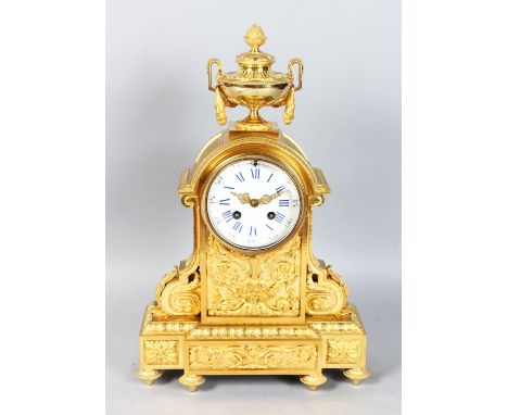 A 19TH CENTURY FRENCH ORMOLU MANTLE CLOCK, with eight-day movement, white enamel dial, blue Roman numerals, the ornate case w