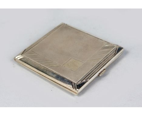 AN ENGINE TURNED CIGARETTE CASE.